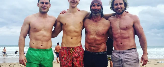 Wim and group of fit men at the beach showing strong physiques and active lifestyle