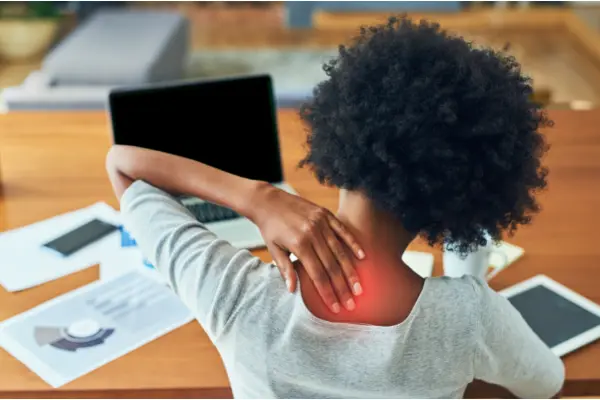 woman holding her neck feeling pained