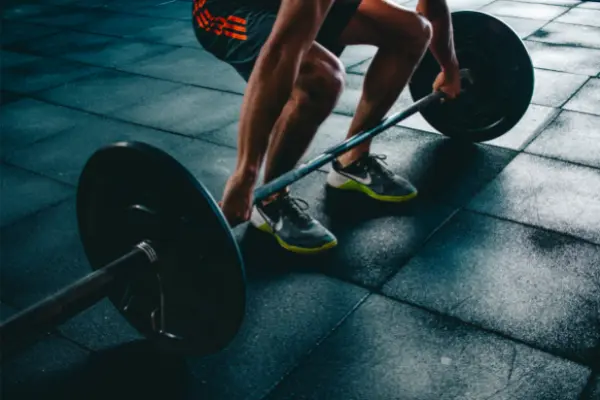 person holding a barbell