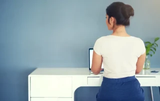 woman with a perfect posture sitting working