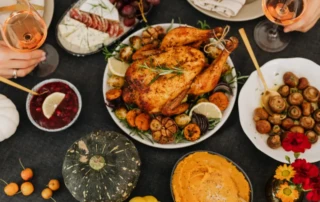 Healthy whole food dinner spread with roast chicken, vegetables, and wine – illustrating quality nutrition without macro tracking