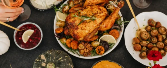 Healthy whole food dinner spread with roast chicken, vegetables, and wine – illustrating quality nutrition without macro tracking