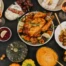 Healthy whole food dinner spread with roast chicken, vegetables, and wine – illustrating quality nutrition without macro tracking