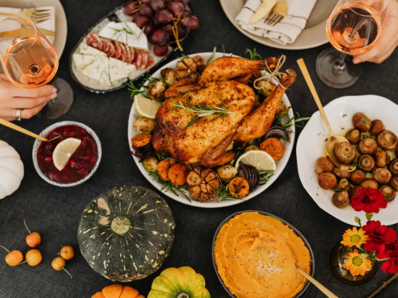Healthy whole food dinner spread with roast chicken, vegetables, and wine – illustrating quality nutrition without macro tracking