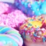 Colourful donuts with sprinkles, representing mindful indulgence and balanced eating without guilt