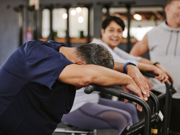 Getting back into exercise at 5th Element Wellness in Fitzroy North, showing a fatigued client during training to highlight the risks of restarting without guidance.